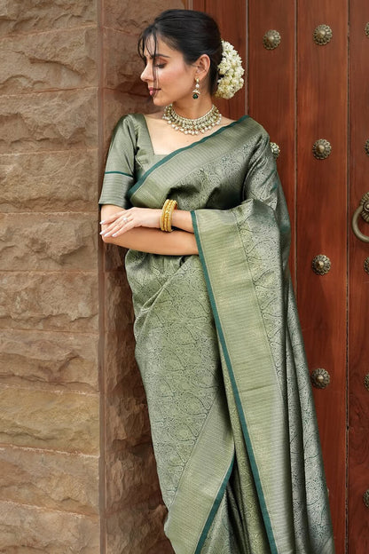 Blissful Dark Green Soft Silk Saree With Sizzling Blouse Piece