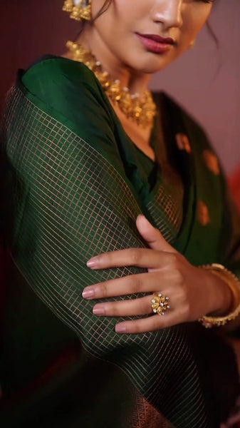 Entrancing Dark Green Soft Silk Saree With Captivating Blouse Piece