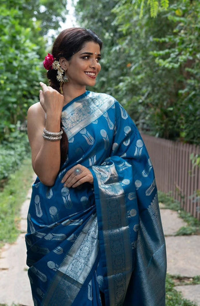 Ornate Blue Soft Silk Saree With Denouement Blouse Piece