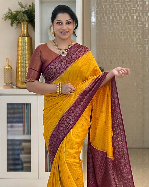 Adorning Yellow Soft Silk Saree With Unique Blouse Piece
