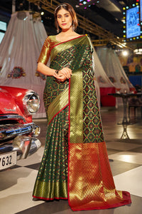 Beauteous Dark Green Patola Silk Saree with Pleasant Blouse Piece