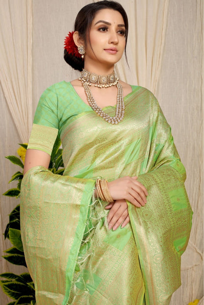Outstanding Pista Kanjivaram Silk Saree With Glittering Blouse Piece
