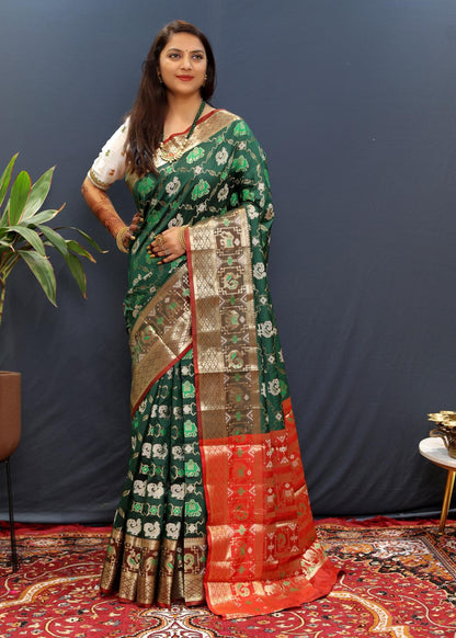 Magnificat Dark Green Patola Silk Saree with Ineffable Blouse Piece