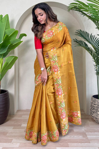 Engrossing Mustard Embroidery Work Tussar Silk Saree With Prominent Blouse Piece
