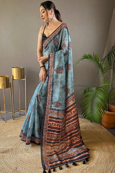 Adoring Firozi Digital Printed Tussar Silk Saree With Radiant Blouse Piece